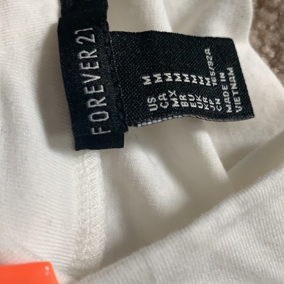 White and black turtlenecks w/ shoulder cut outs - Picture 3 of 3